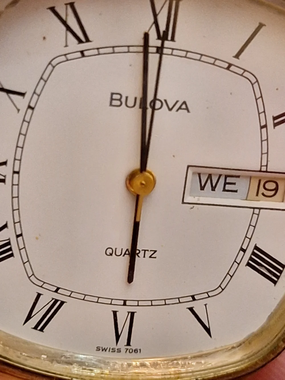 Bulova Gold and White Dress Watch with Roman Numerals‎